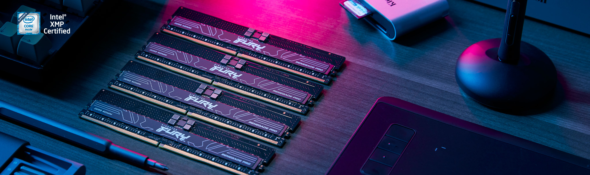 Four Kingston FURY Renegade Pro RDIMMs sit on a desk.