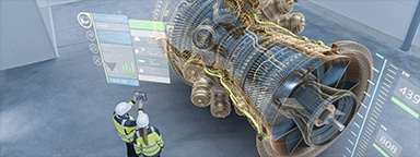 Immagine di due tecnici in uno stabilimento, mentre utilizzano un modello 3D con realtà aumentata raffigurante un motore