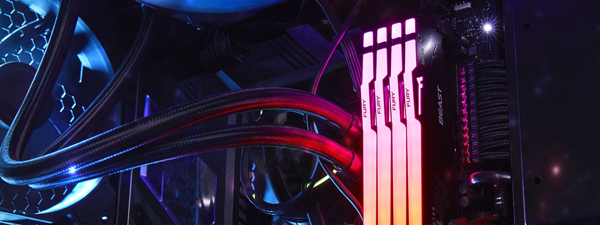 FURY Beast DDR5 RGB 内存条在台式游戏电脑机箱内的发光特写镜头