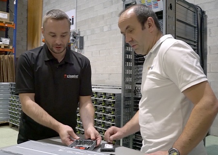 Kingston and 2CSRi engineers installing Kingston SSD into a server rack
