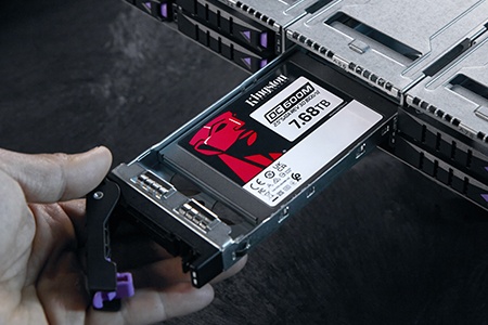 A Kingston Server SSD in a sled is being mounted into a server