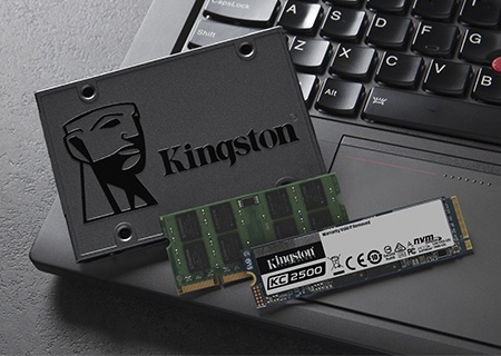 Kingston 2.5 inch and M.2 SSDs with SODIMM memory sitting on a laptop keyboard