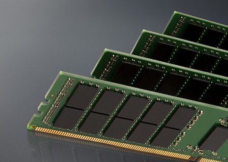 Kingston memory modules on a grey background with a reflection beneath it
