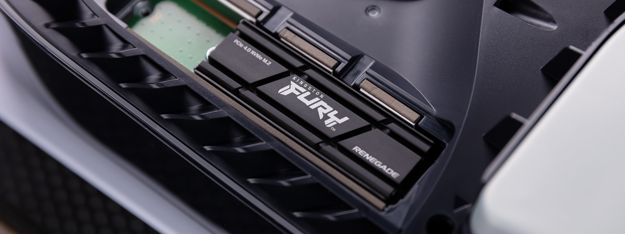 Kingston FURY Renegade SSD with heatsink installed in a PlayStation 5 gaming console