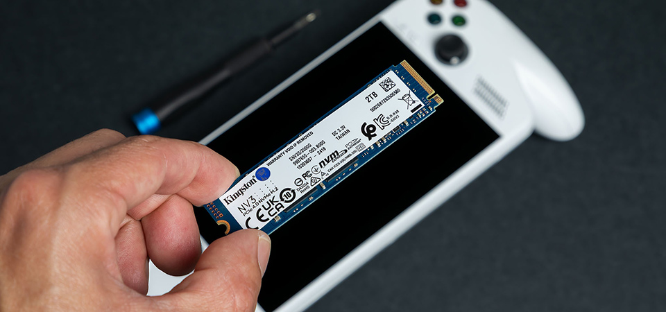 A Kingston NV3 SSD sits next to a ROG Xbox Ally and a screwdriver