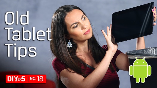 Trisha holding a tablet over a track can