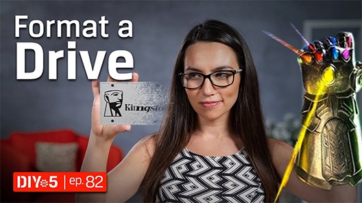 Trisha holding an SSDs with one hand and the Infinity Gauntlet on the other hand.