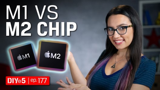 Trisha showing off an M1 and an M2 chip.